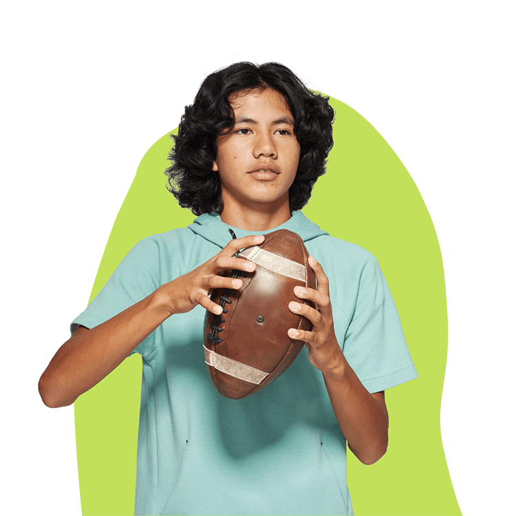 Boy with Hormonal Acne holding Football